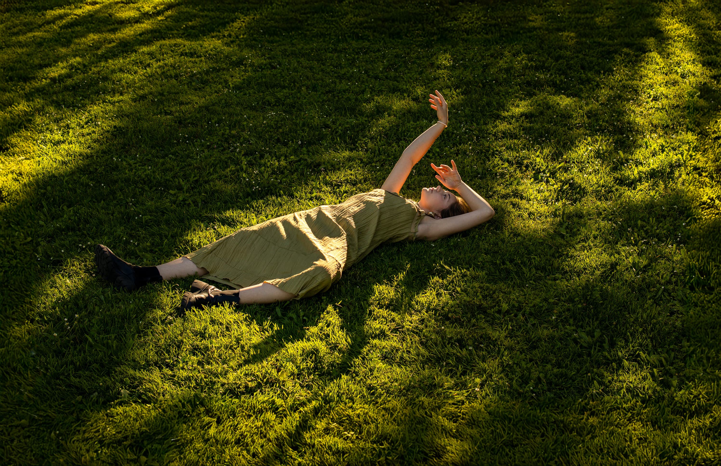 woman laying in grass